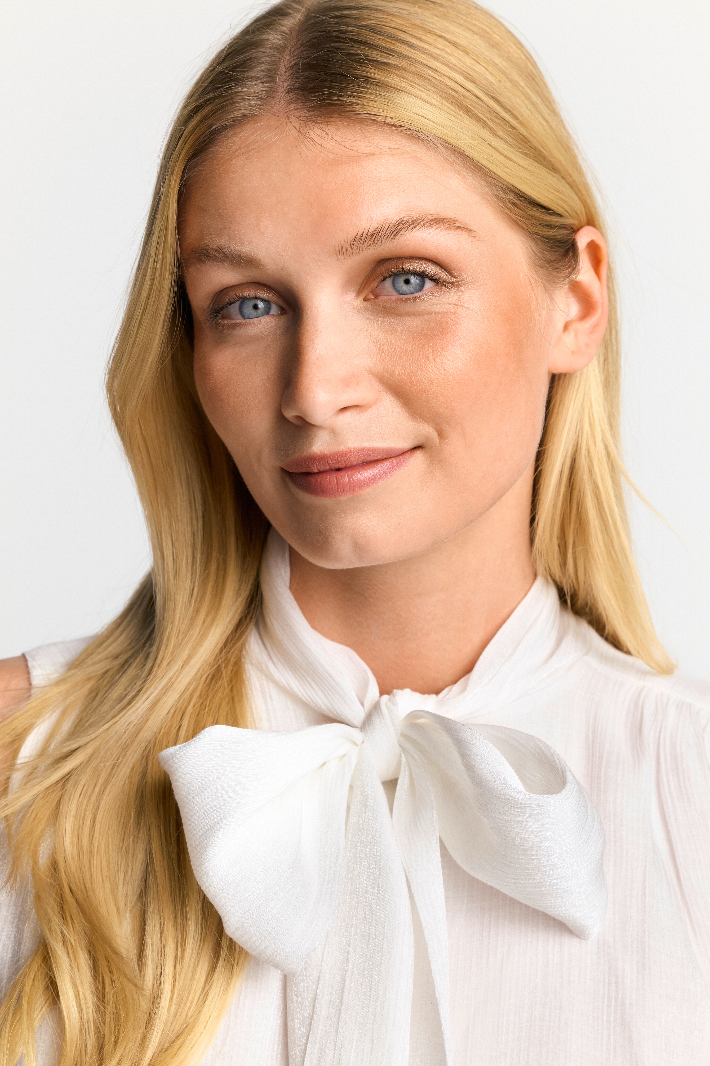 Shiny blouse with bow