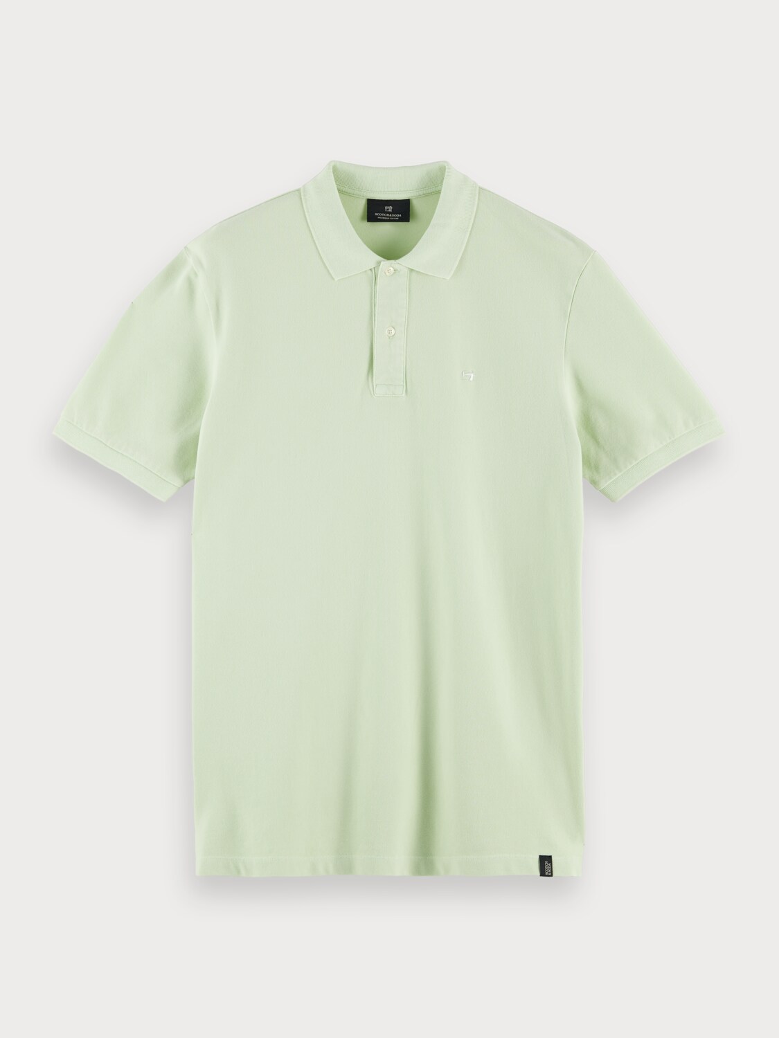 Organic cotton garment-dyed pique polo with washing