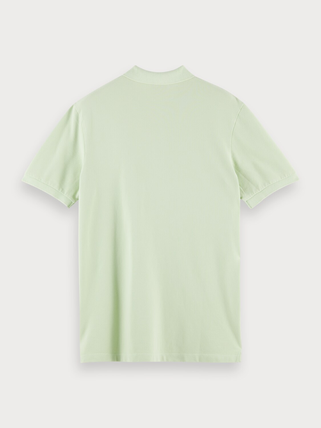 Organic cotton garment-dyed pique polo with washing