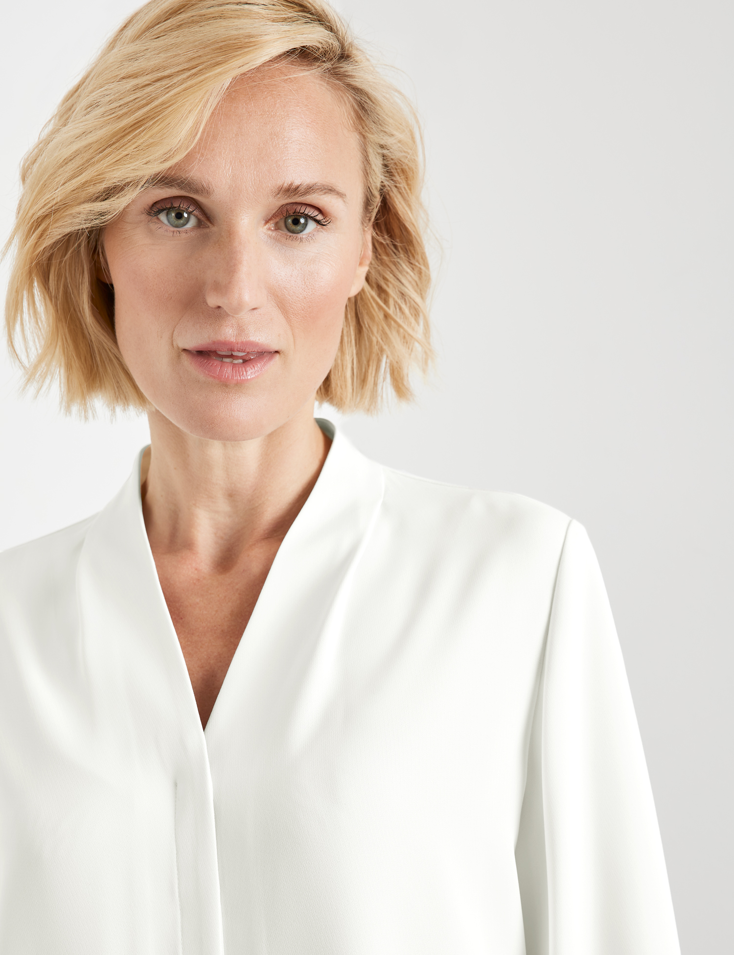 Langarmbluse mit gelegten Falten